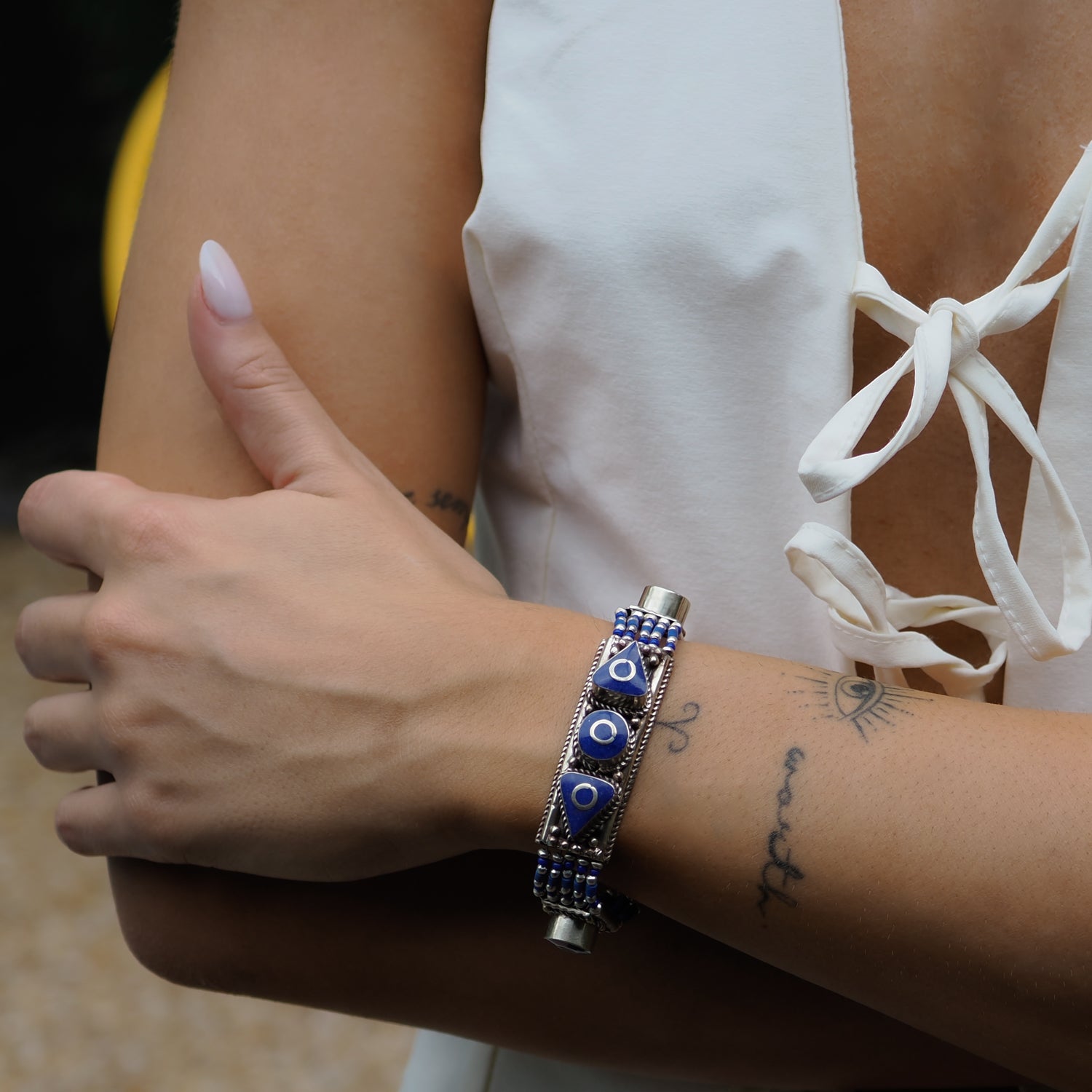 Close-up of a Nepal Design bracelet with lapis lazuli stones set in detailed Nepalese silver craftsmanship.