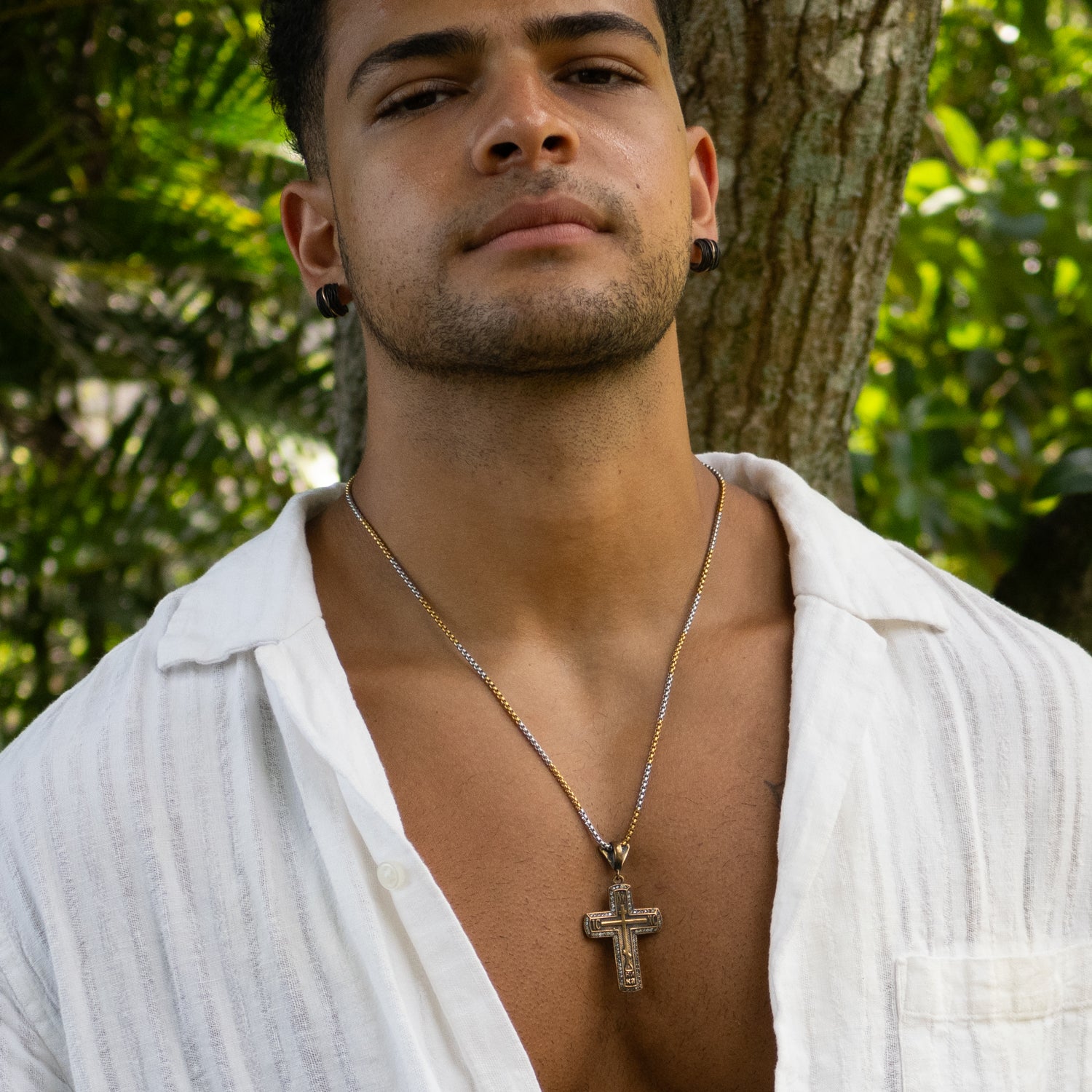Statement cross necklace for men with pave diamonds and luxurious gold over silver.
