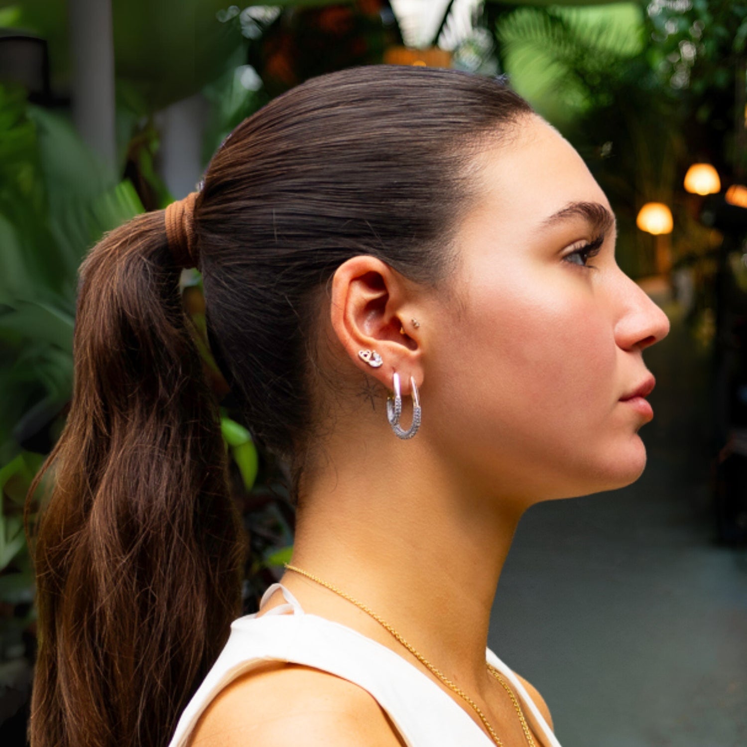 Dazzling Pave Diamonds Gold Hoop Earrings with a mid-size design, 18K gold-plated base, and CZ accents.