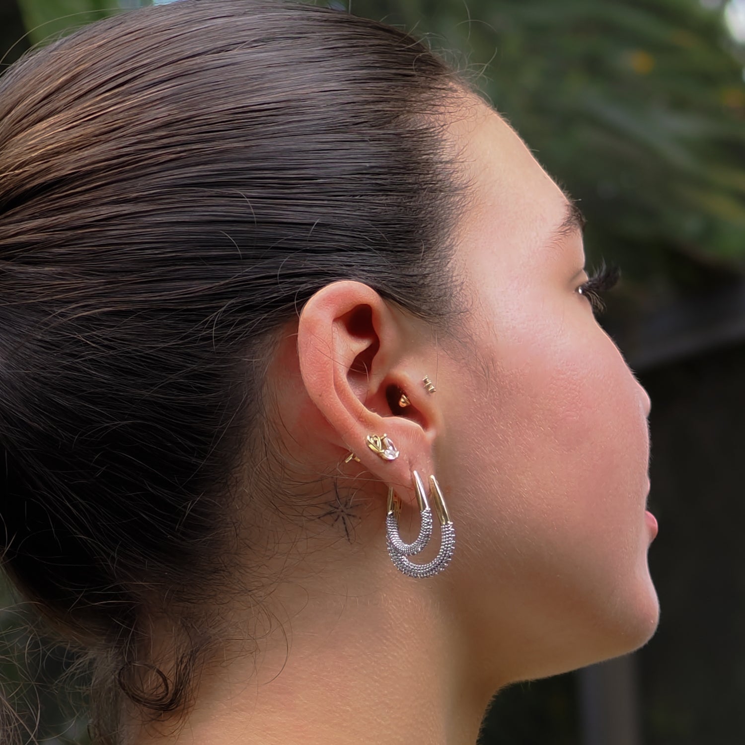 Elegant mini gold hoop earrings adorned with pave CZ diamonds, perfect for timeless style and sophistication.
