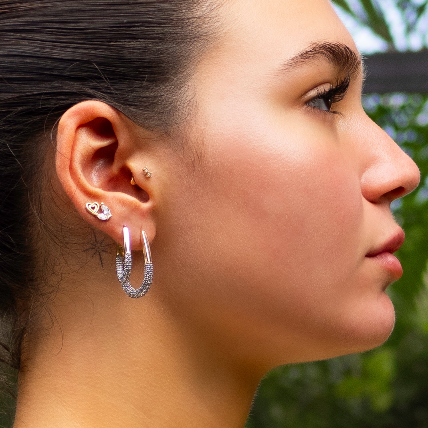 Stylish mini hoop earrings with CZ diamonds and 18K gold plating for a glamorous and modern touch.