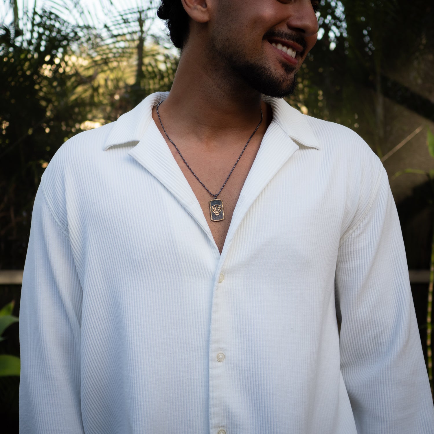 Handmade lion medallion necklace in sterling silver, representing power and courage.