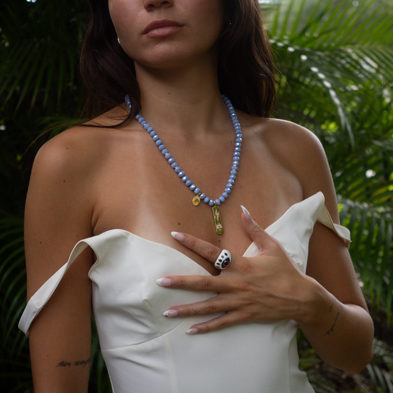 Gold and blue spiritual necklace symbolizing wisdom, grounding, and energy.