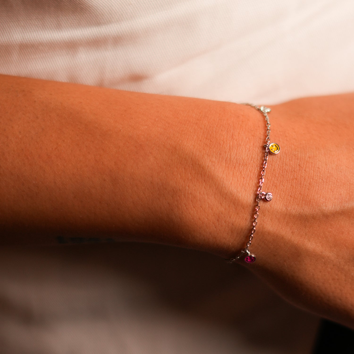 Sterling Silver Bracelet with Smiley Face Charms and CZ Diamonds for a Sparkling, Playful Statement