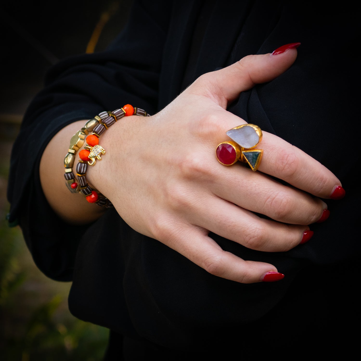 Handmade spiritual ring featuring round, teardrop, and triangle-cut natural gemstones