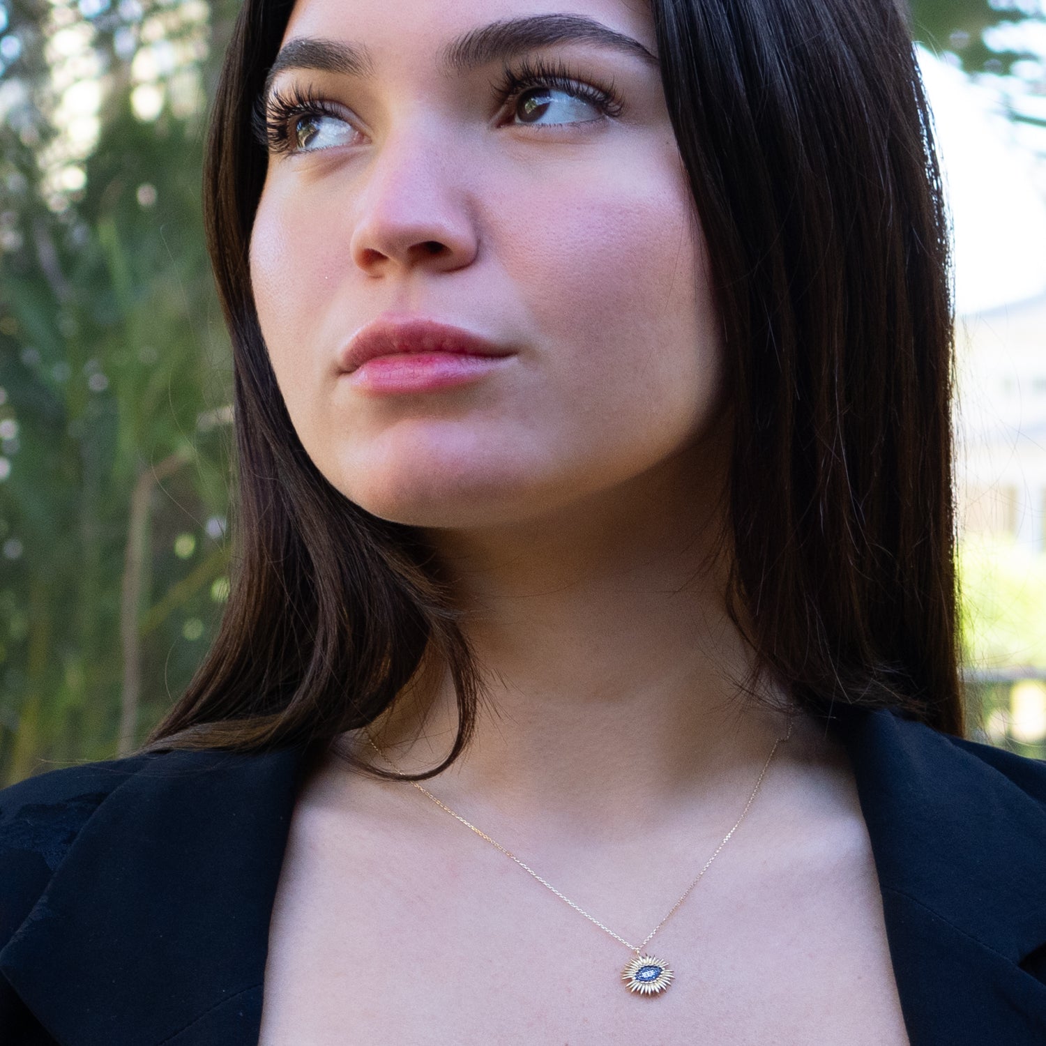 Gold evil eye necklace symbolizing protection and elegance