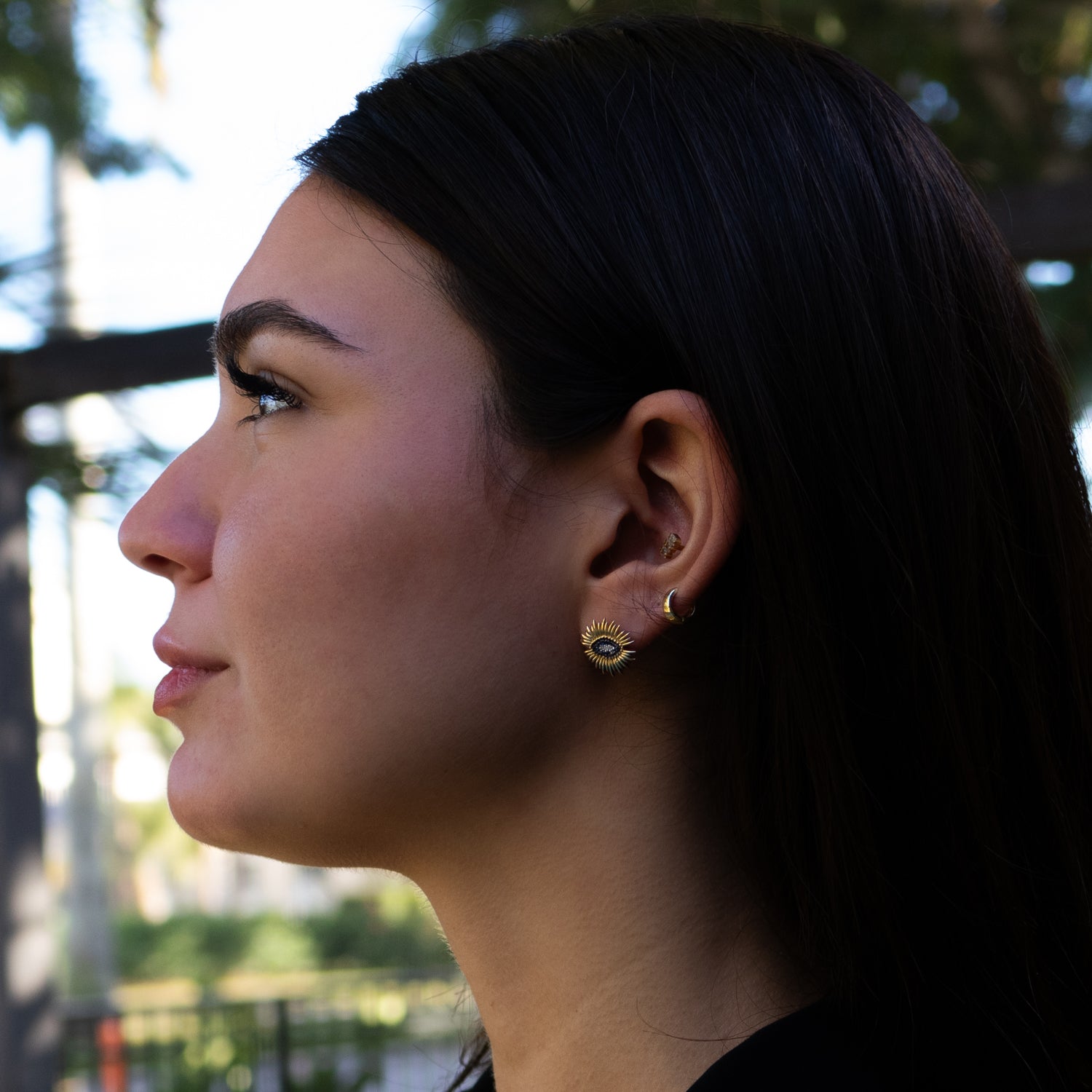 Fine jewelry earrings with evil eye design and gemstone center