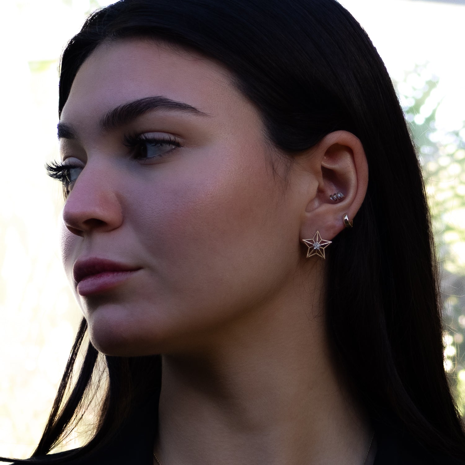 14K solid gold star-shaped stud earrings with center floral diamond symbolizing guidance and hope