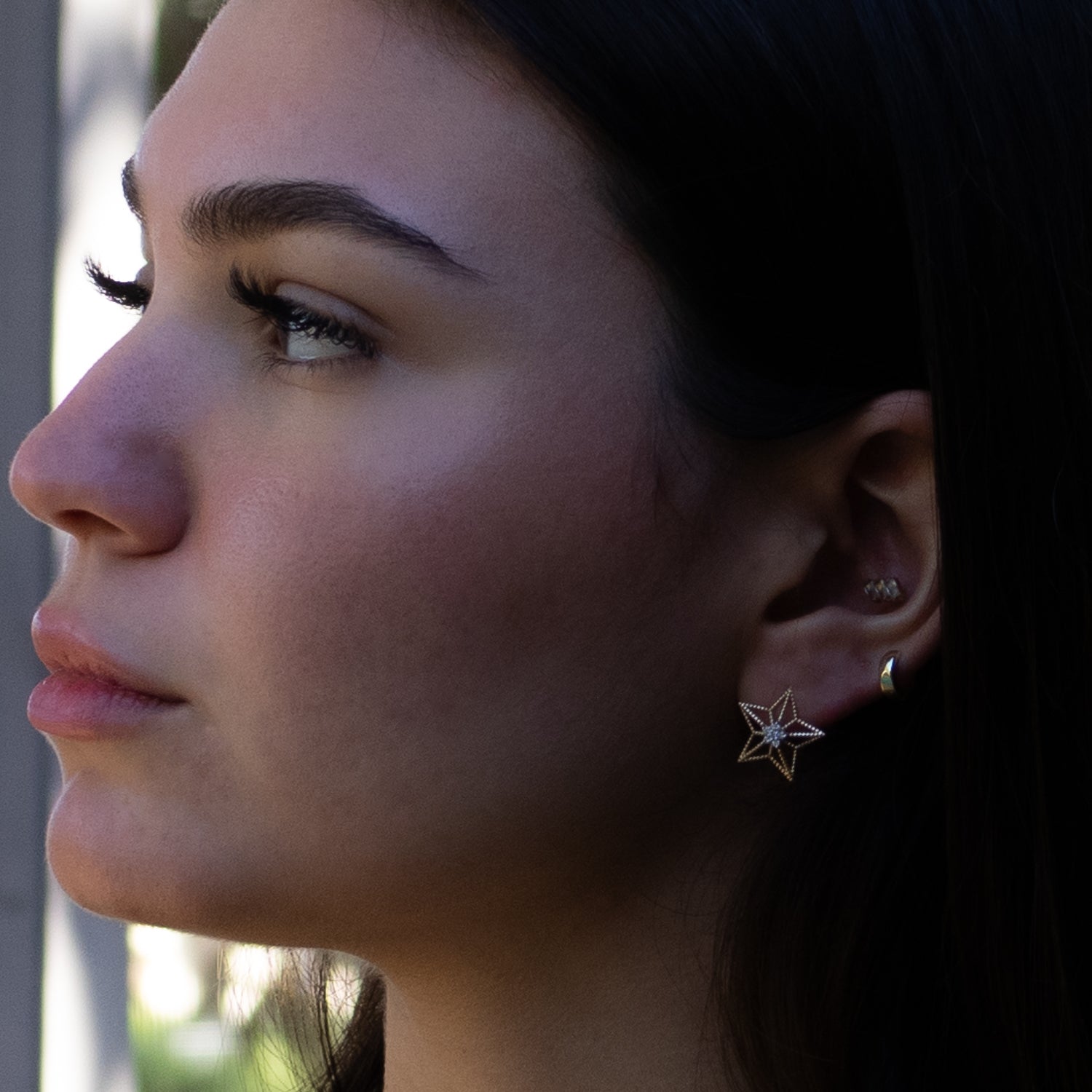 Gold stud earrings shaped like stars with dazzling diamonds, perfect for meaningful gifting