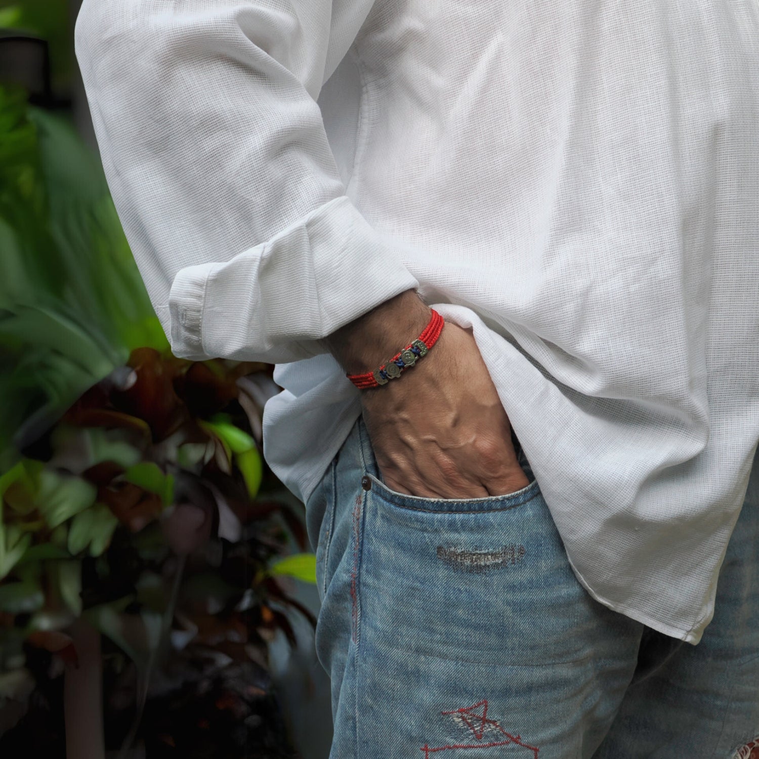 Stylish Spiritual Soul Bracelet with four red cords and sterling silver symbols for a meaningful accessory.