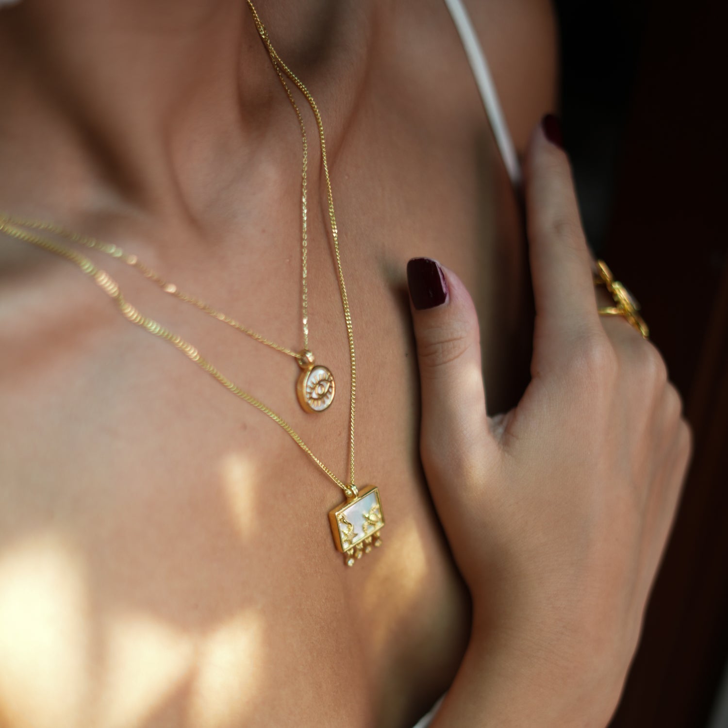 Gold Pendant Necklace with Starfish, Seahorse, and Turtle Symbols on Pearl for Ocean-Inspired Style
