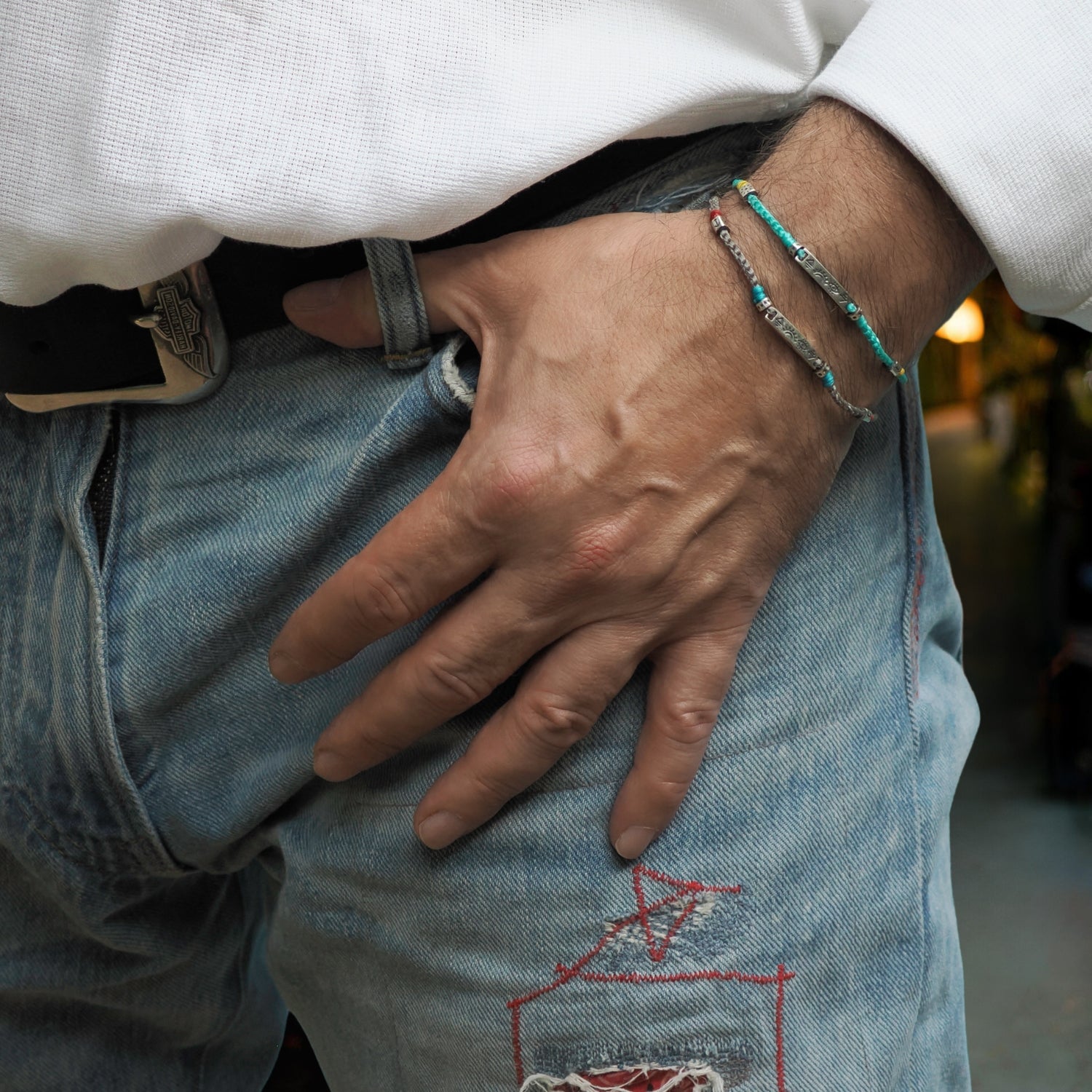 Chic spiritual bracelet with a turquoise braided design and sterling silver accents symbolizing hope and calmness.