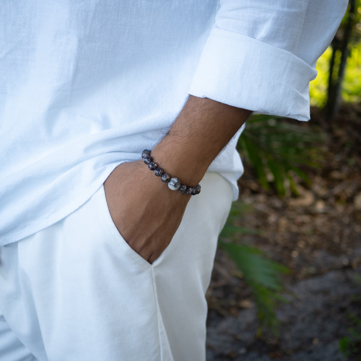 Men's bracelet with grounding jasper beads, detailed silver beads, and striking agate centerpiece.
