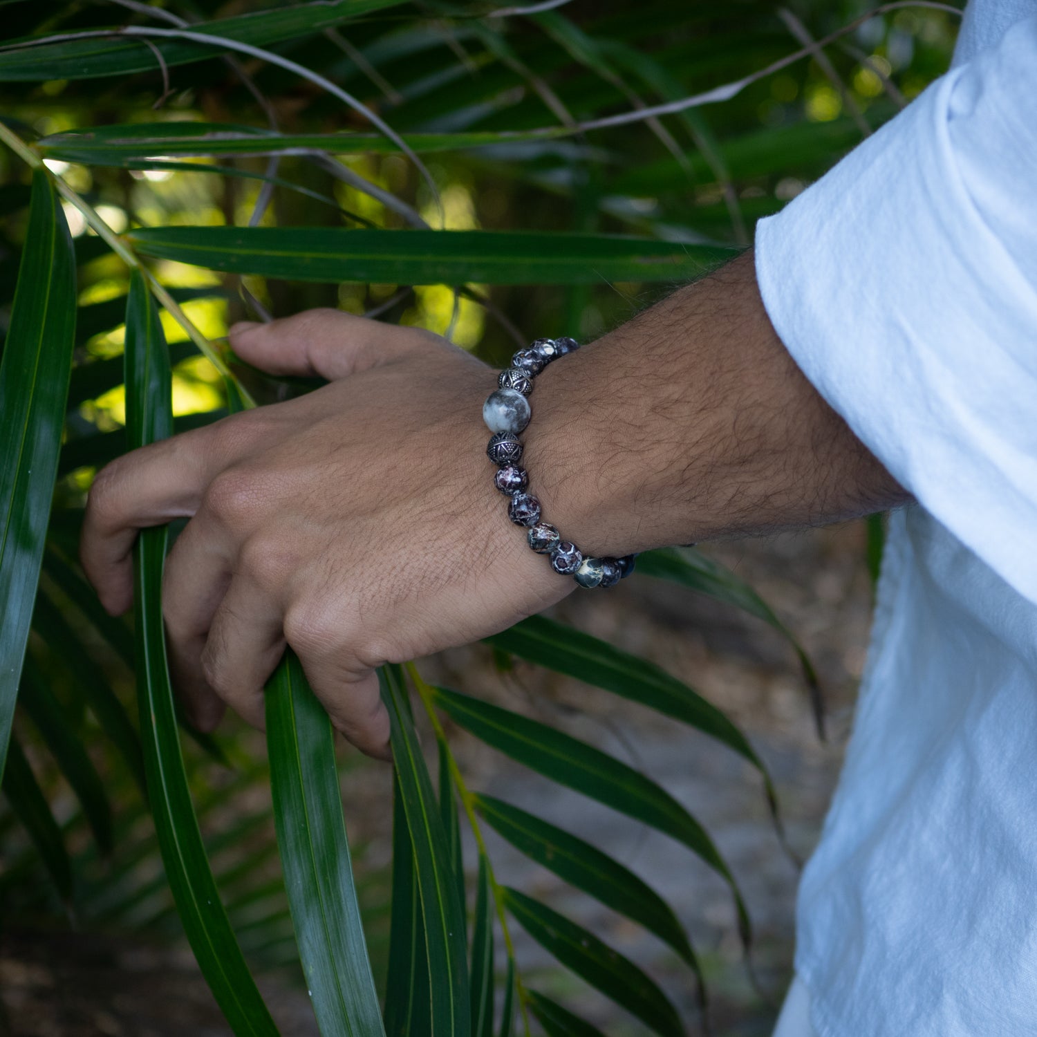 Stylish beaded bracelet featuring 8mm jasper stones, 9mm tribal silver, and 12mm agate bead.