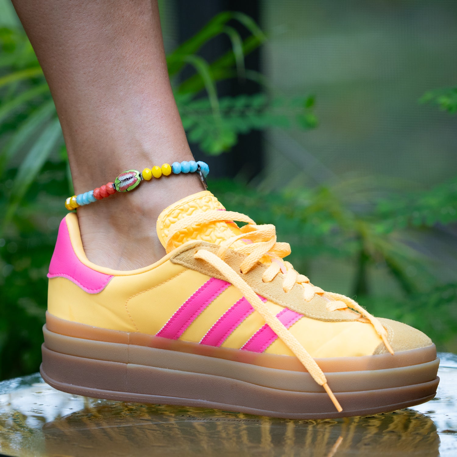 Summer anklet featuring faceted crystal beads and protective Hamsa charm.