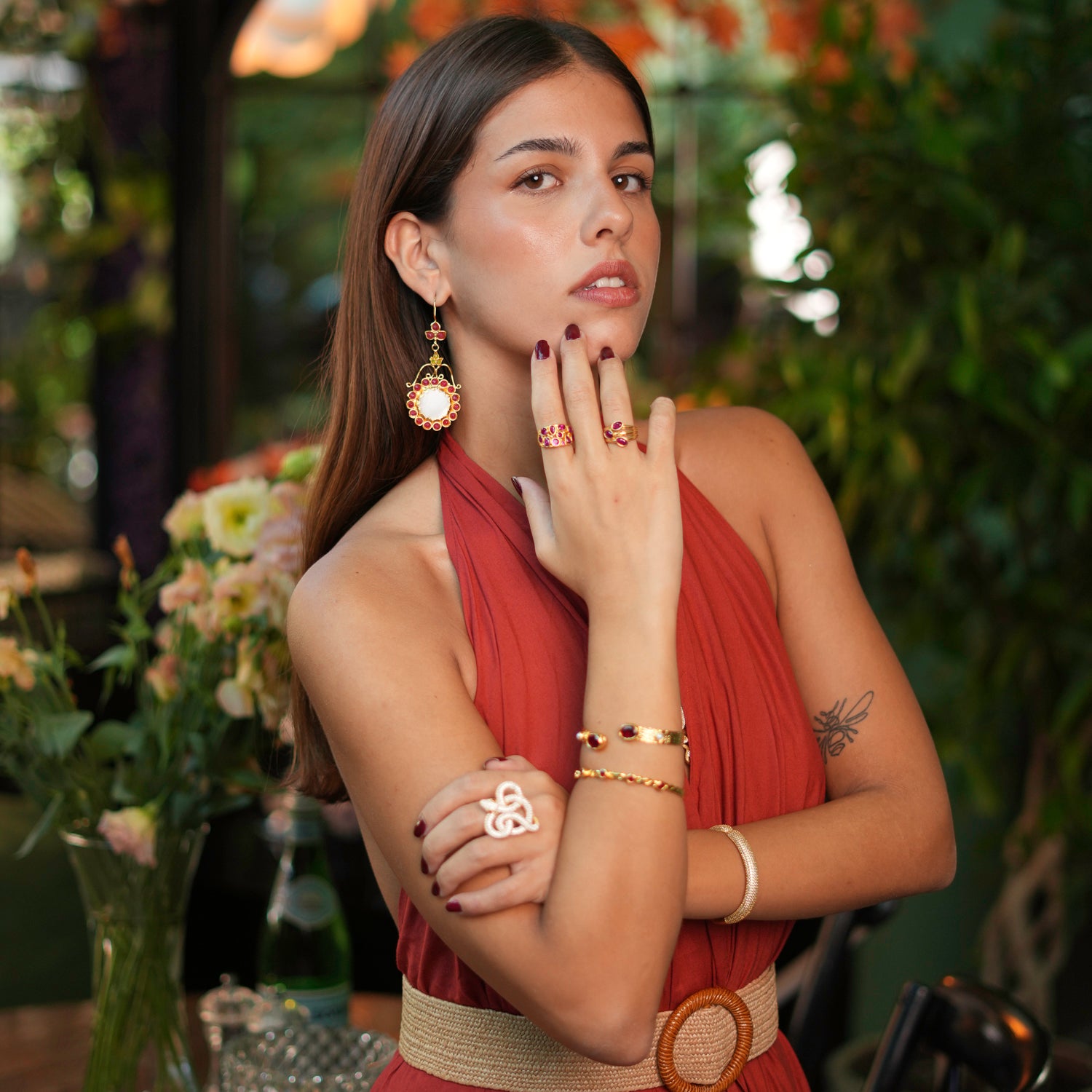 Stunning ring with teardrop-shaped rubies and a 24k gold-plated brass setting, featuring an adjustable band for versatile wear.