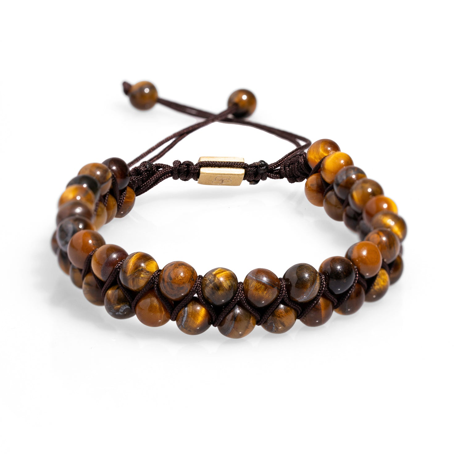Adjustable beaded bracelet featuring tiger's eye stones for courage and a woven slider clasp for comfort.