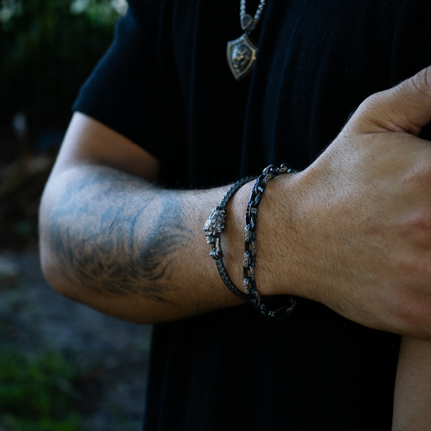 Men’s sterling silver bracelet featuring tribal engraving and a bold chain style.