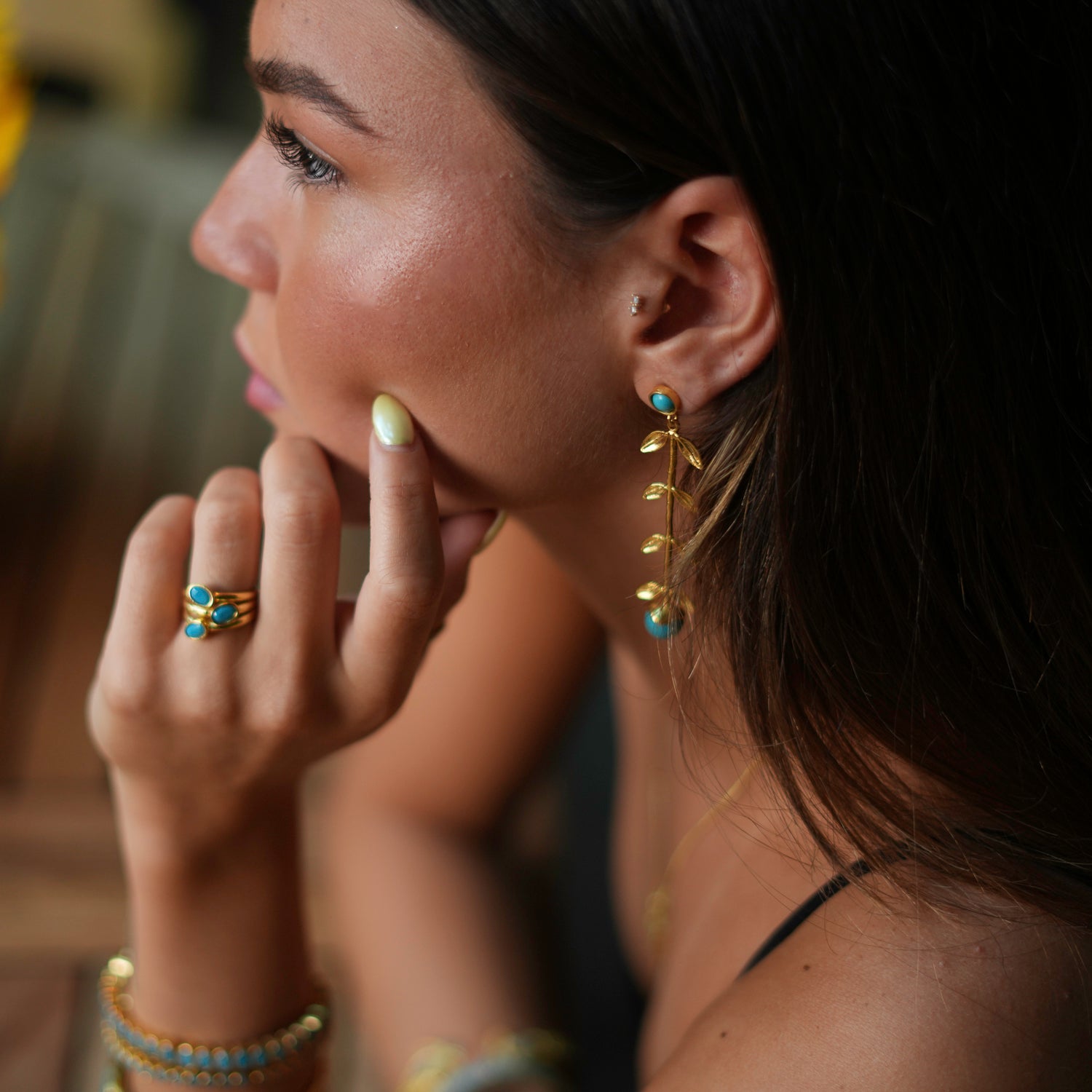 Bold and stylish adjustable ring featuring three turquoise gemstones on a luxurious 24k gold-plated brass base.