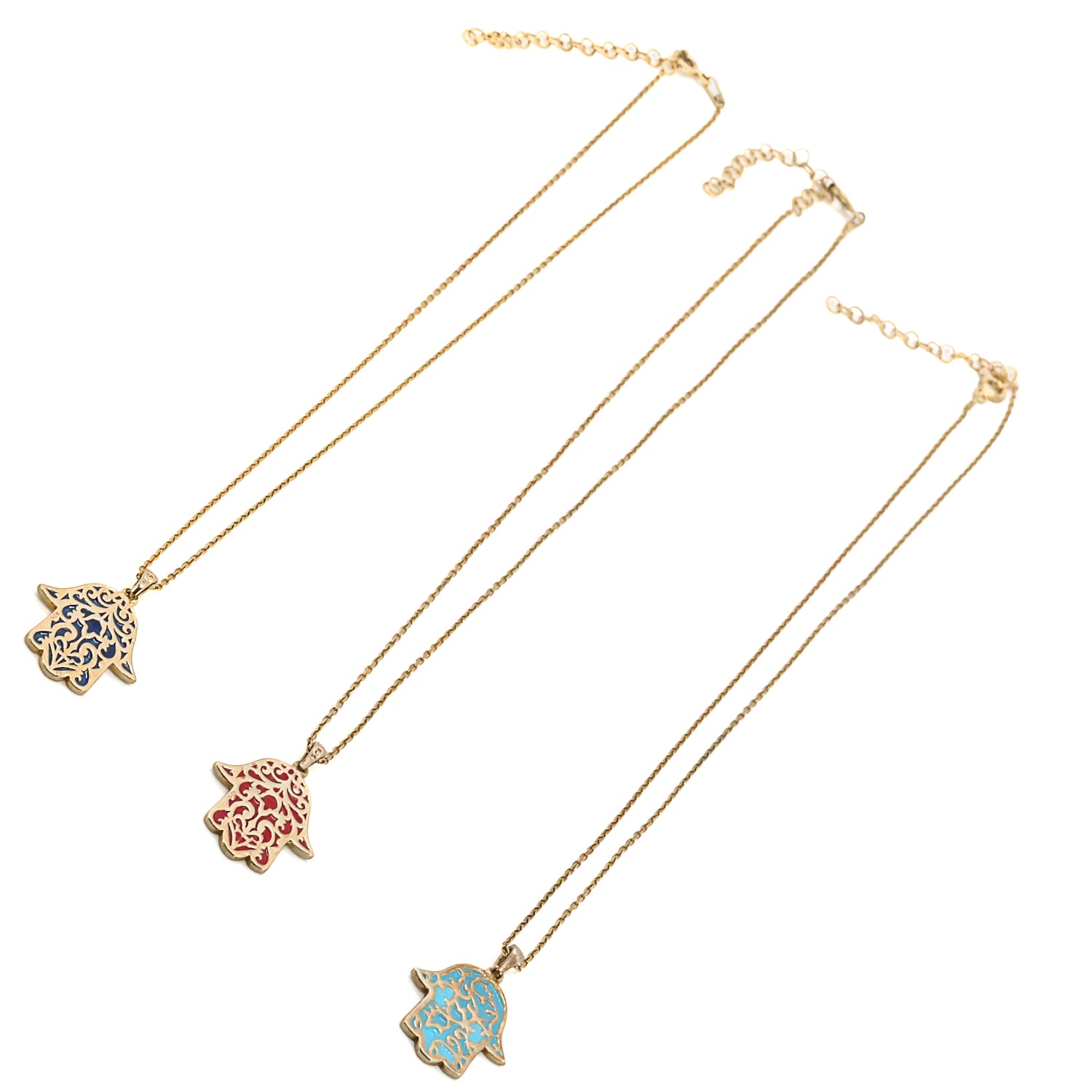 Adorn yourself with the Stay Positive Hamsa Necklace, a symbol of protection and happiness, featuring a beautiful hamsa pendant made of sterling silver and 18K gold plating with enamel accents.