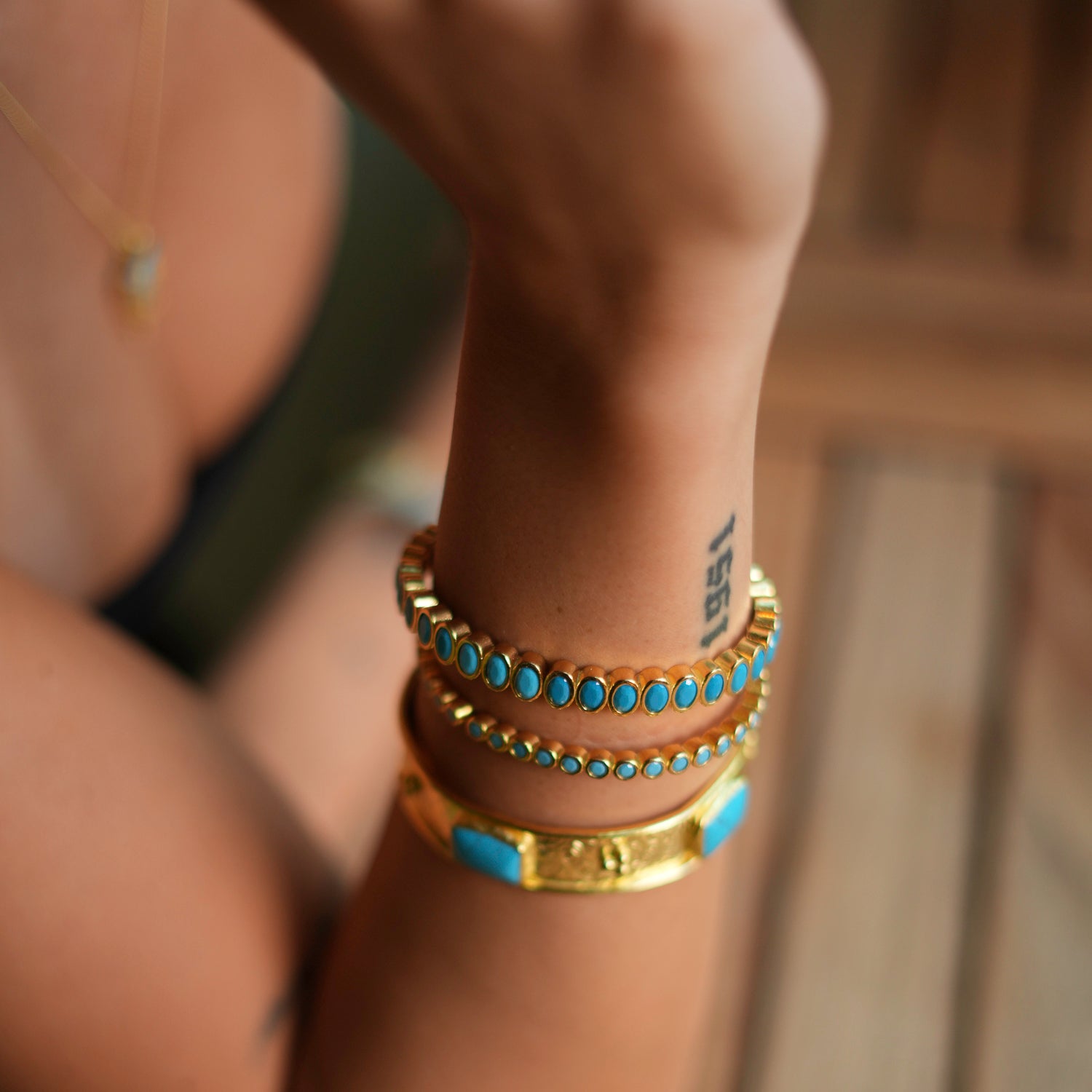 Handcrafted 24K Gold Bangle with Turquoise Teardrop Gemstones for a Luxurious, Energizing Style