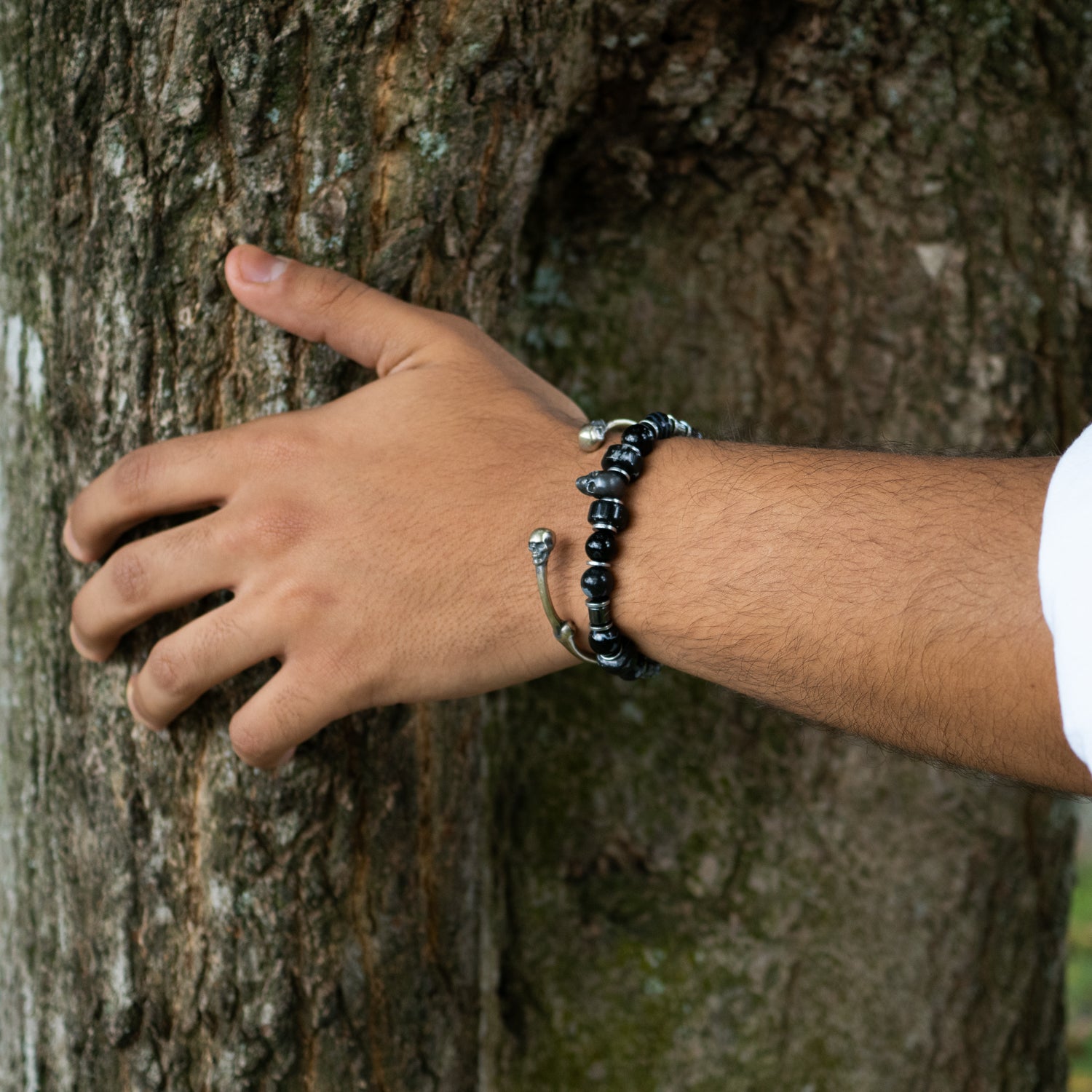 Sterling silver cuff bracelet with bold skull design, handmade for fearless unisex style.