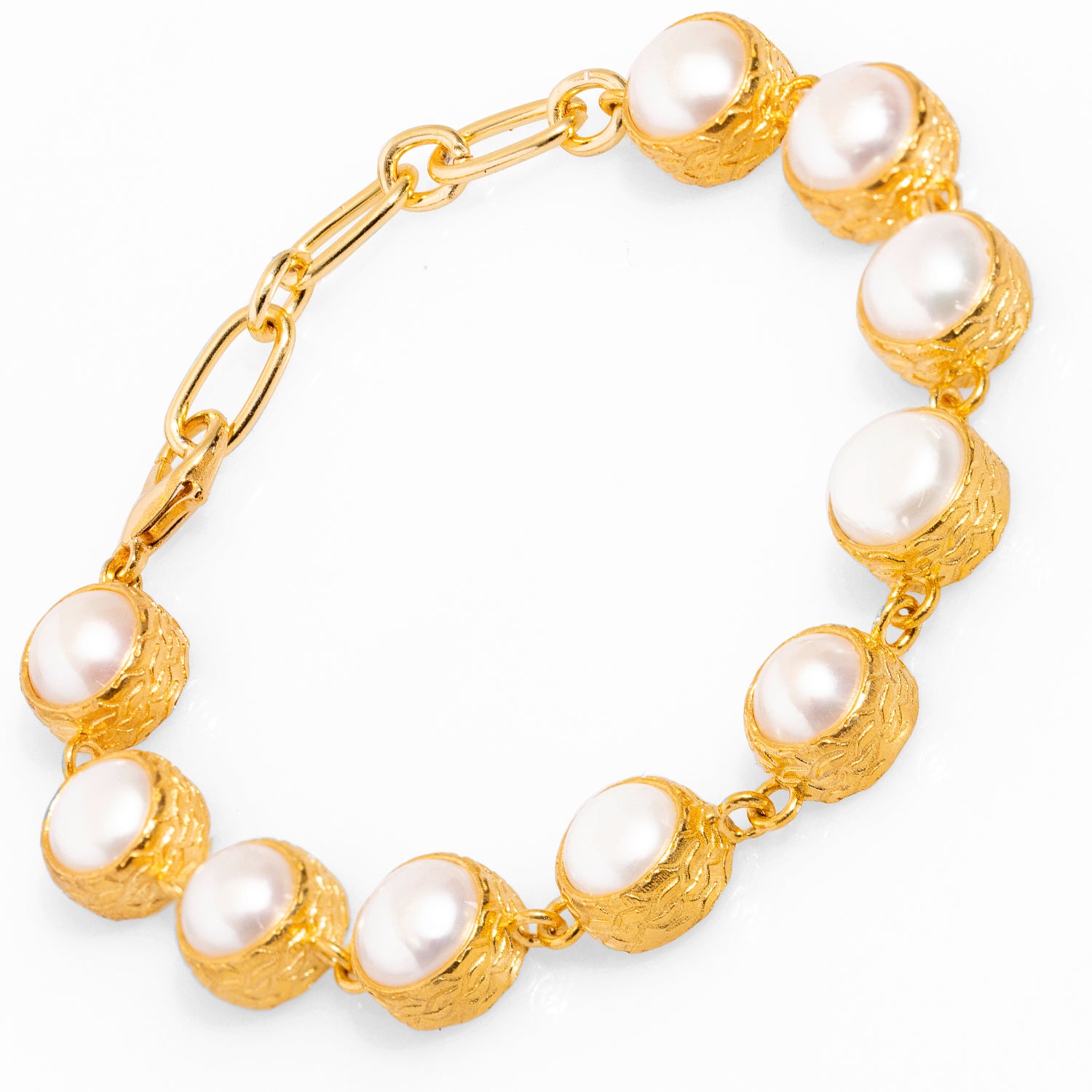 Sophisticated pearl tennis bracelet with vintage-inspired 24k gold-plated settings, ideal for adding timeless glamour to everyday wear.