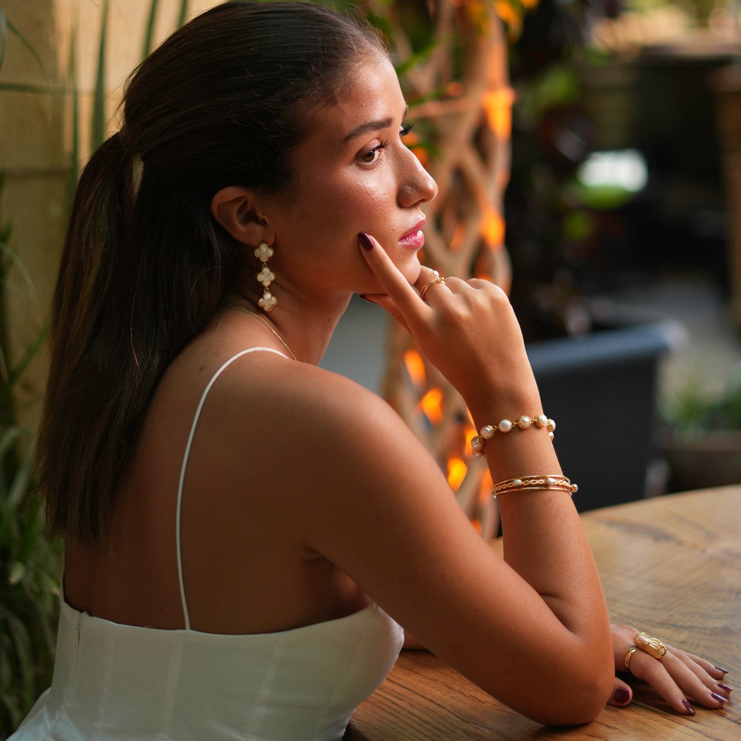 Beautiful vintage-style bracelet featuring a row of round pearls set in 24k gold-plated settings, perfect for elegant occasions.