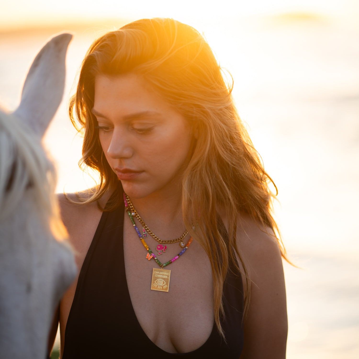 Protected Spirit Rainbow necklace featuring colorful gemstone beads, gold accents, and an eye-shaped charm for a vibrant, meaningful look.