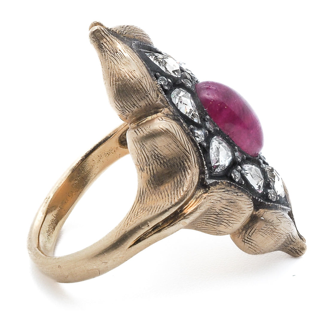 A side view of Aladdin&#39;s Ring, highlighting the unique design and beautiful ruby and diamond combination.
