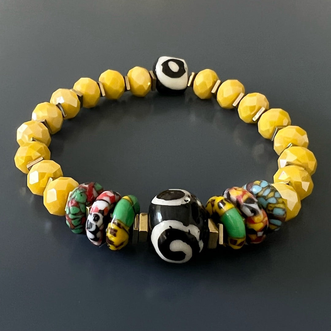 An elegant photo of the African Yellow Women Bracelet, featuring its eye-catching yellow crystal beads and gold hematite stone spacers, perfect for special occasions.