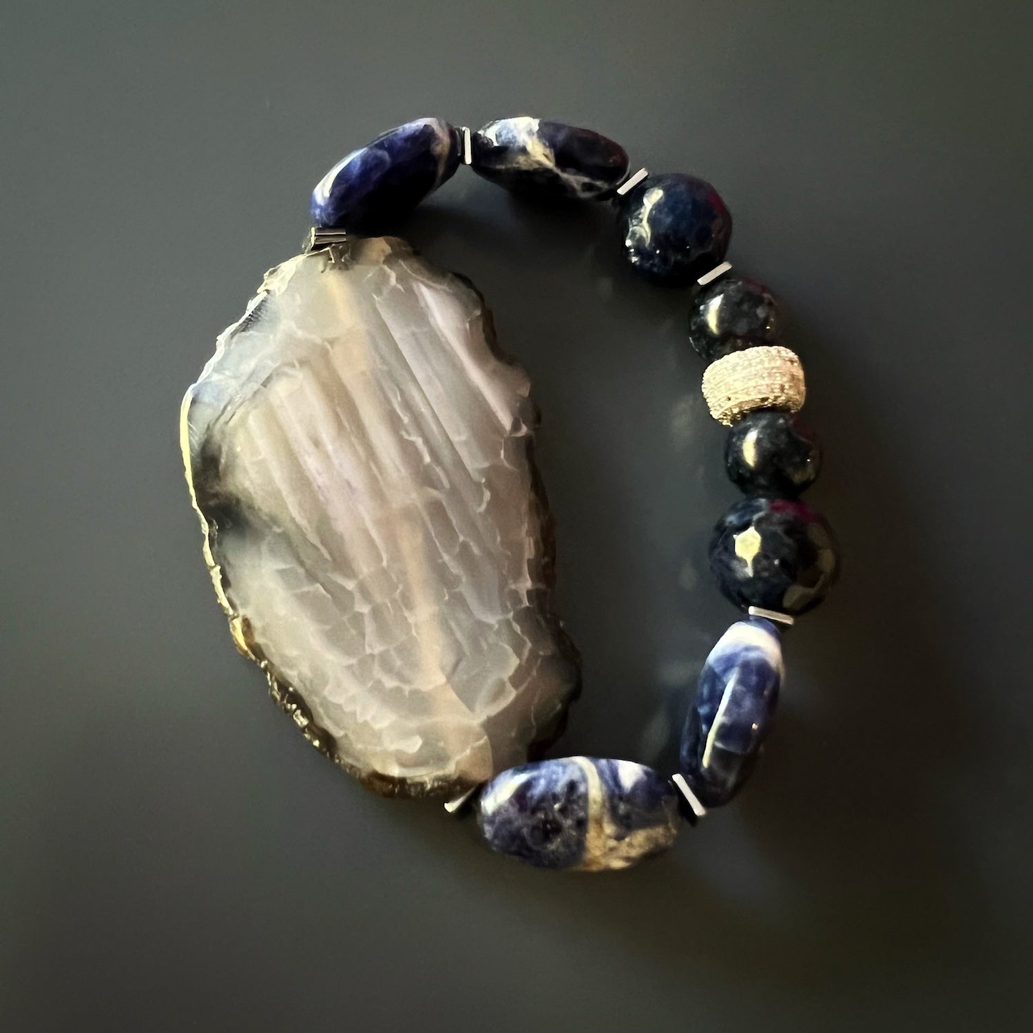 Agate Spiritual Balance Bracelet with natural raw agate stones, flat blue and white sodalite stones, and sparkling Swarovski crystals, designed to promote emotional harmony and balance in daily life.