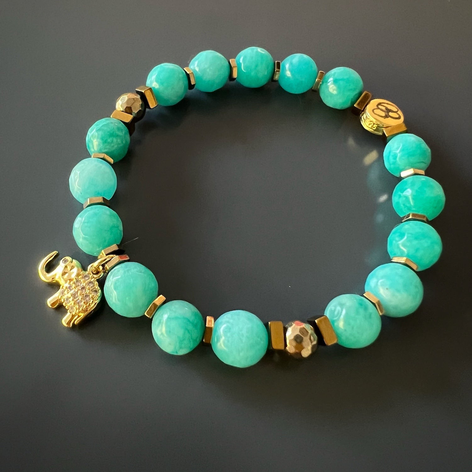 Elevate your style with the elegant combination of Amazonite and gold-tone accents