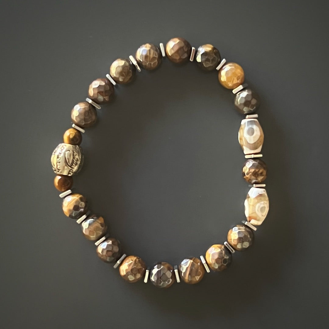 Elevate your style and balance your energy with the Amor Men Bracelet, handcrafted from hematite stone beads and silver color spacers.
