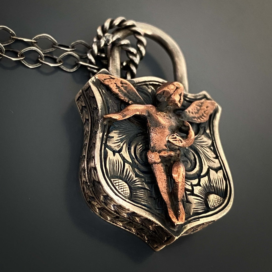 Stay Trendy with the Angel Lock Necklace: Layer with other necklaces or wear it alone