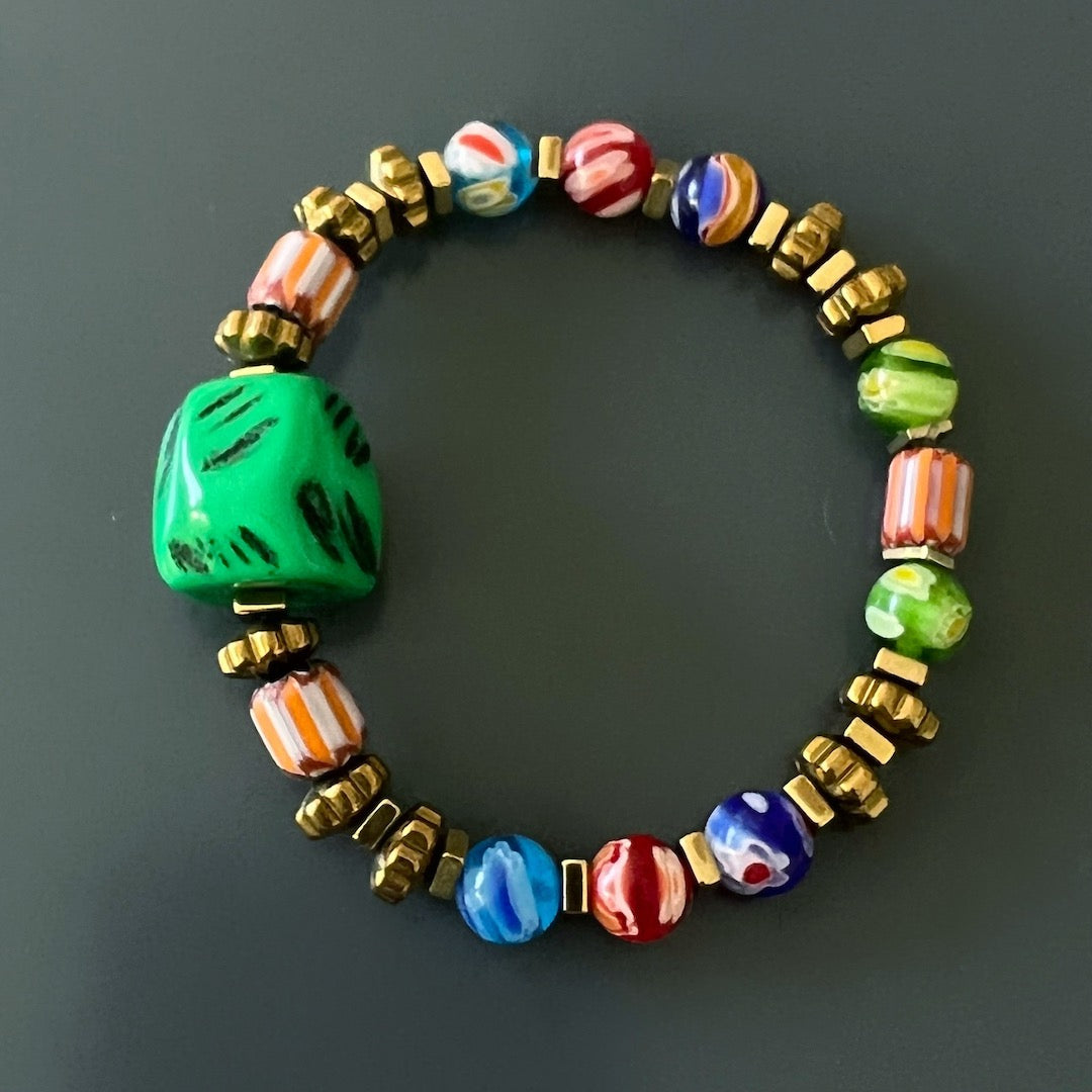 A striking image of the African Colors Women Bracelet displayed against a sleek black background, highlighting its vibrant African and Nepal Beads.