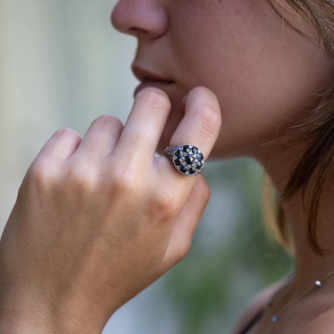 Model wearing the exquisite Black Rose Signet Ring for a stylish and sophisticated look