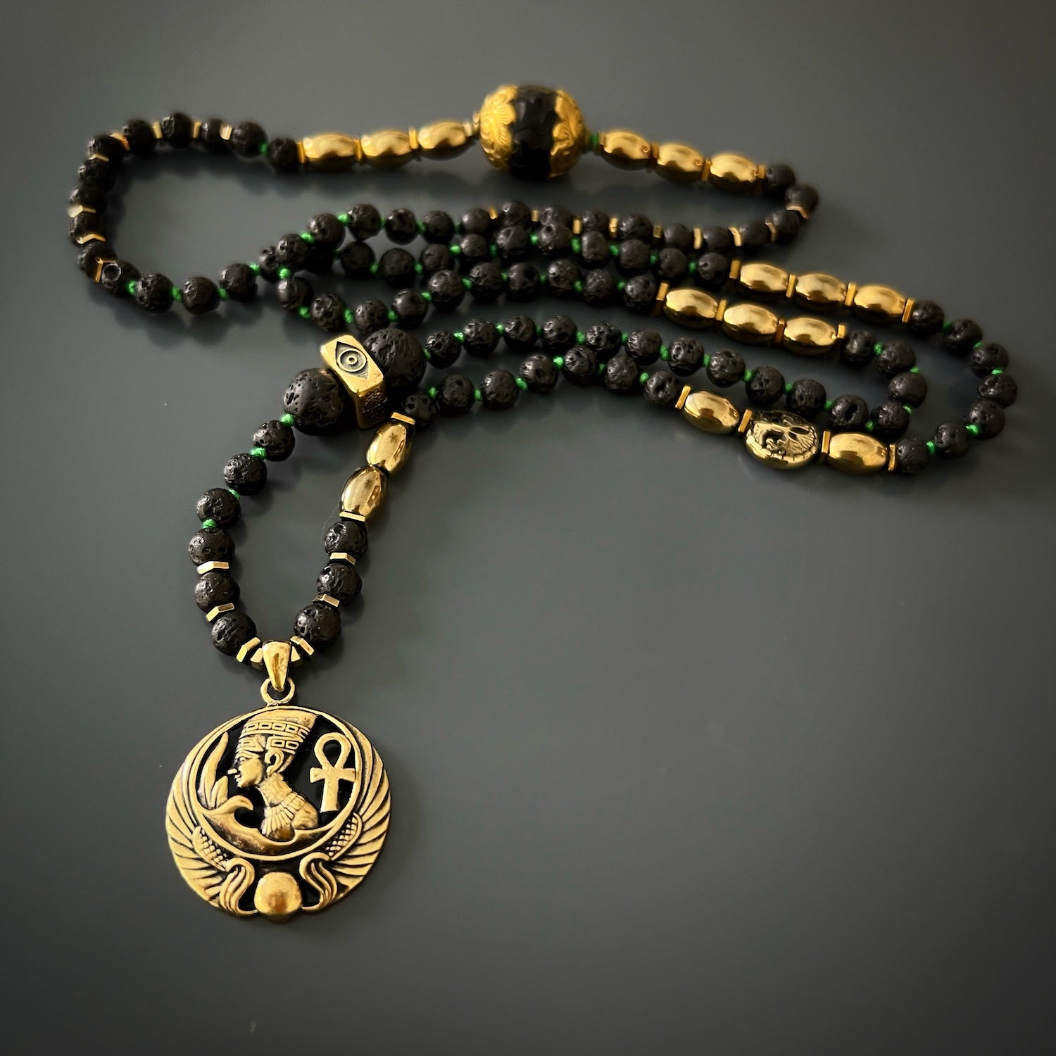Symbolic Black Queen Nefertiti Necklace with Elephant, Hamsa, and Evil Eye Bead