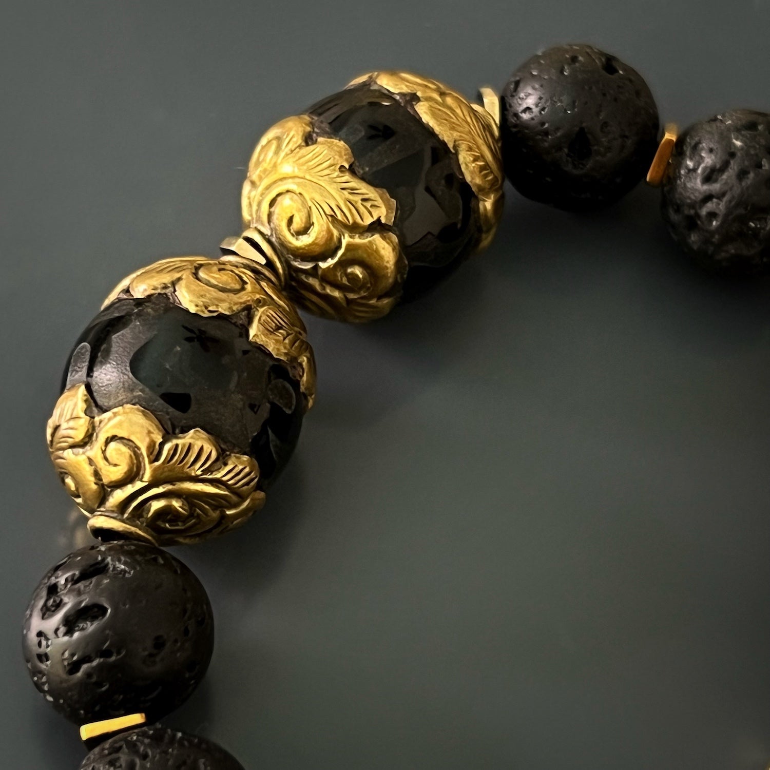 Embrace strength, wisdom, and good fortune with the powerful symbols on the Black Nepal Talisman Bracelet