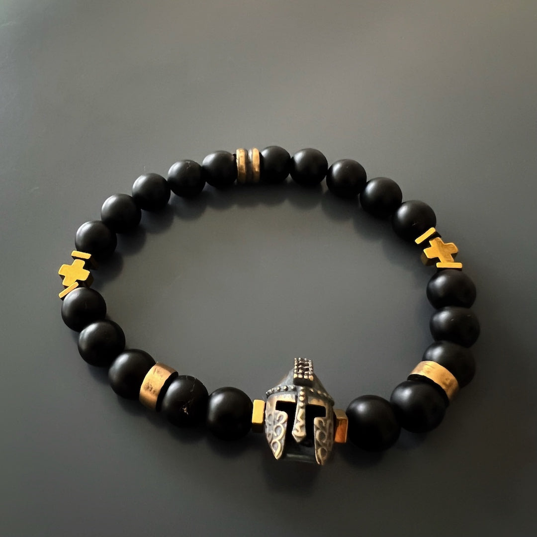 Striking design: Handmade bronze gladiator charm on the Black Vibe Men's Gladiator Bracelet