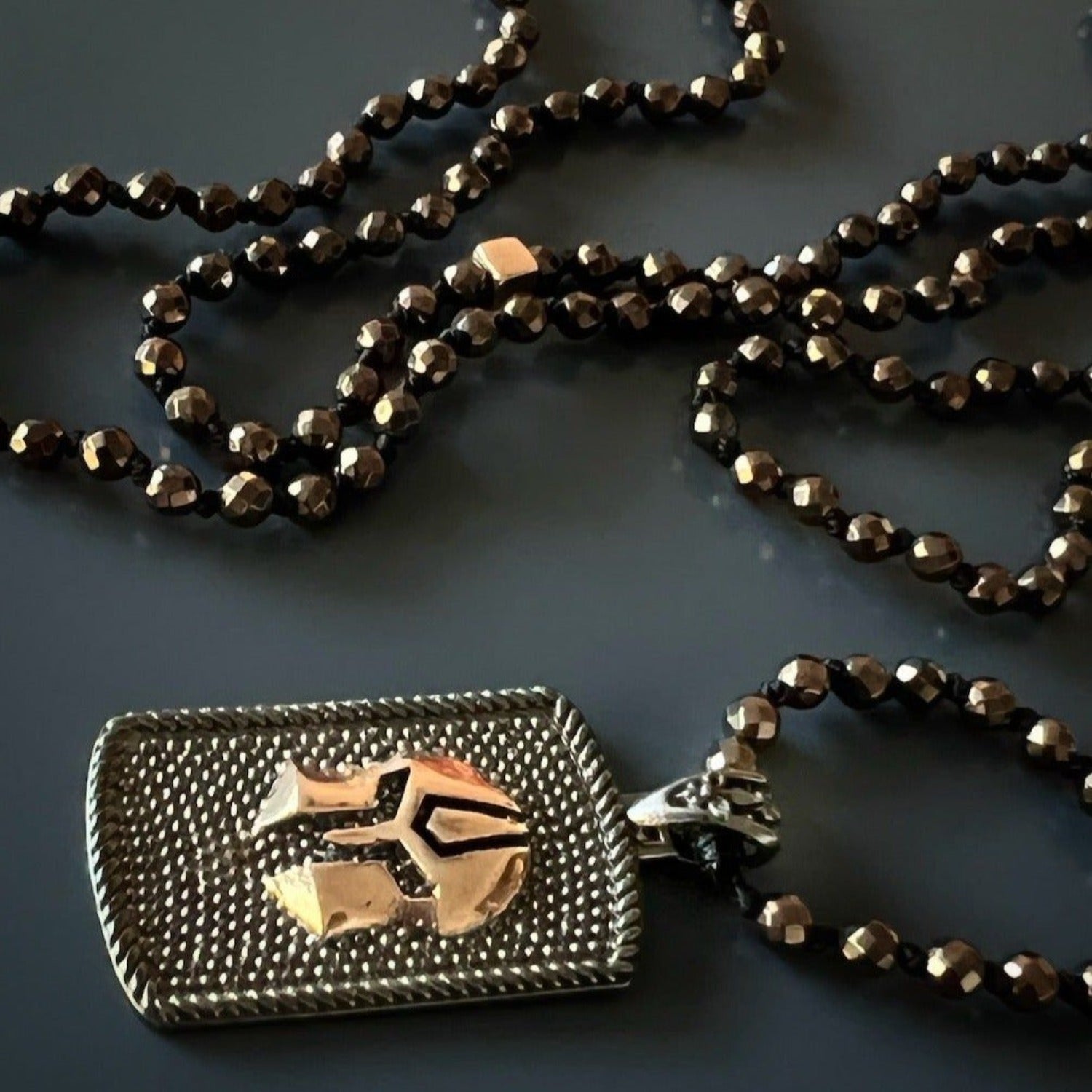 Statement necklace with solid silver gladiator pendant and protective hematite stone beads.