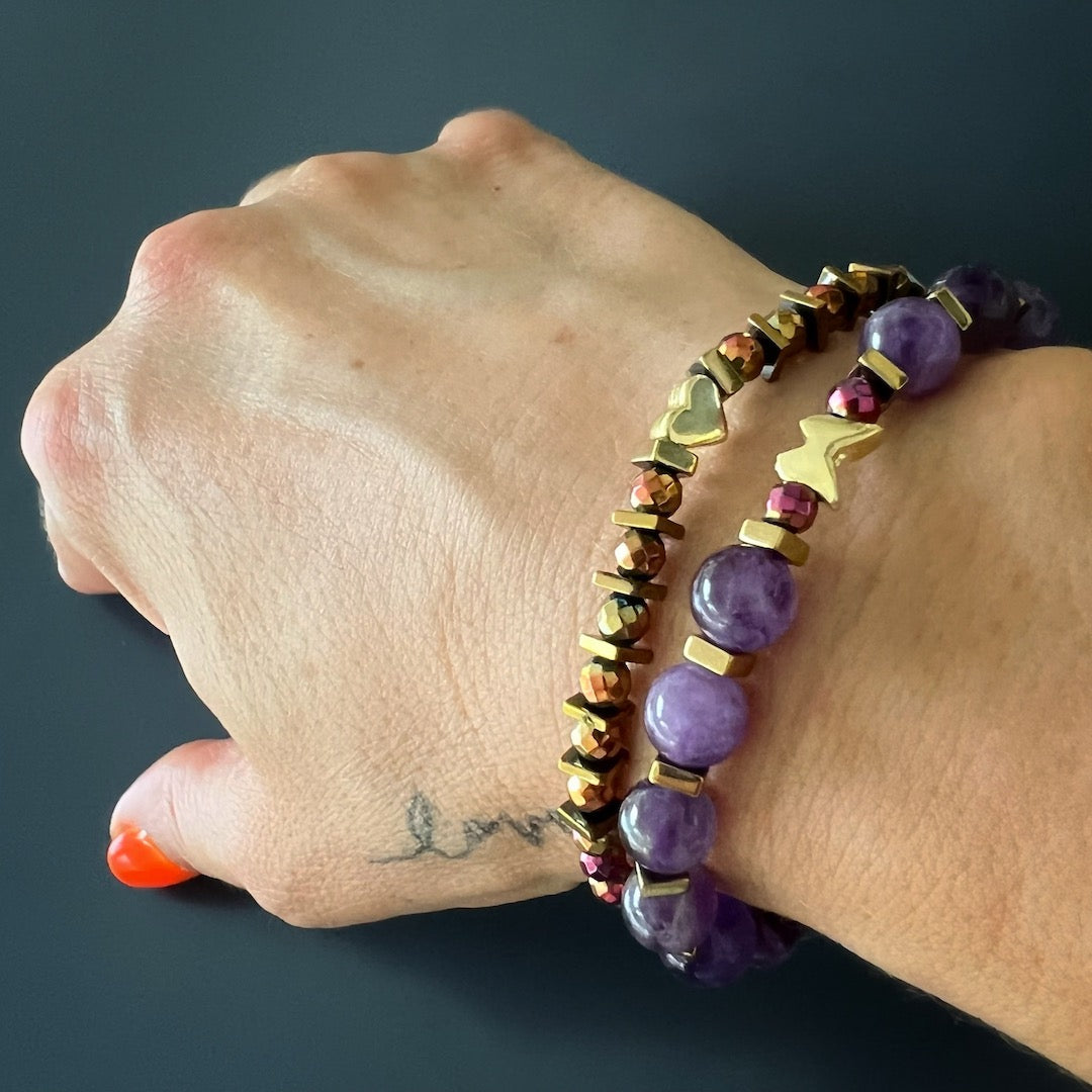 Hand model wearing the stunning Butterfly Love Amethyst Bracelet Set.