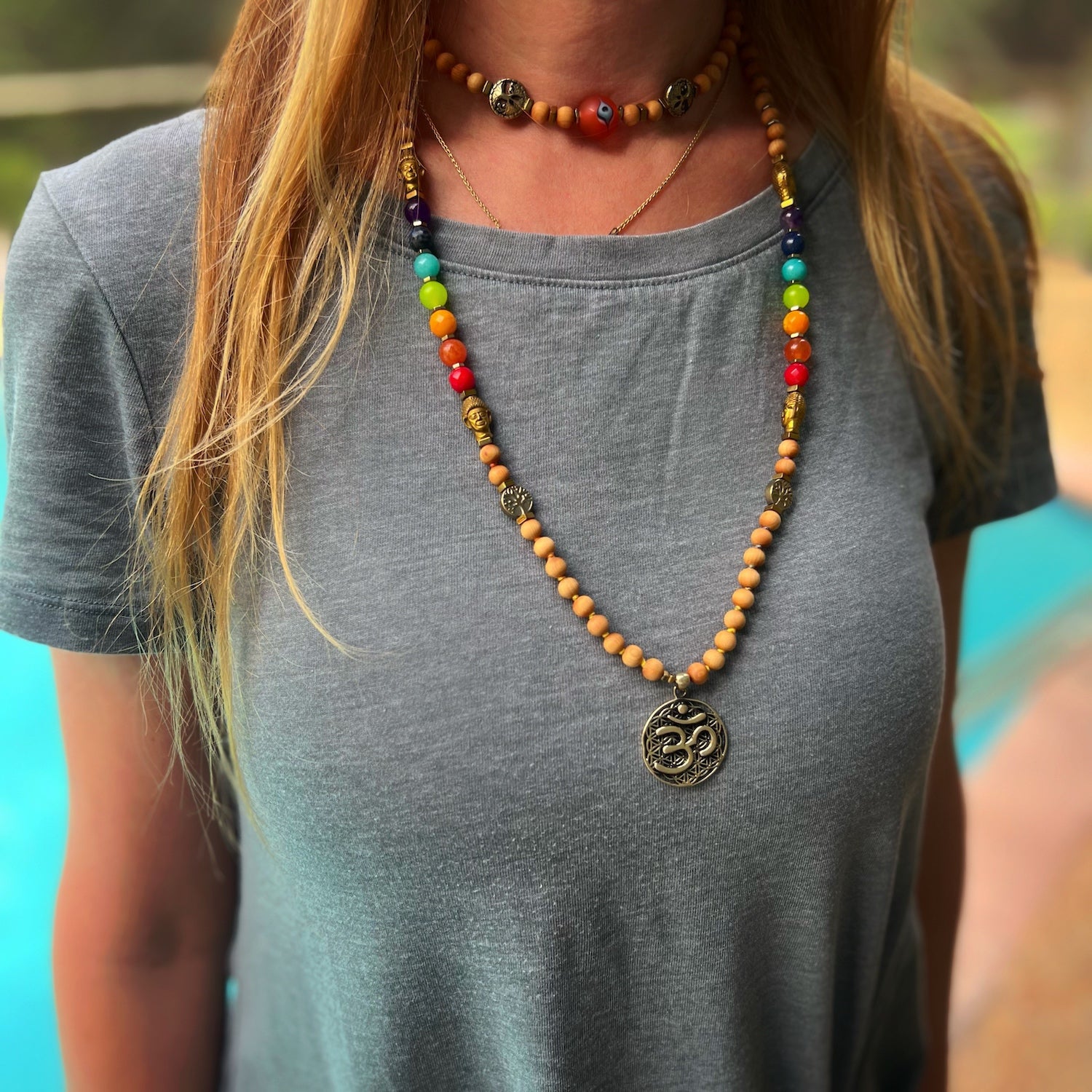 Model showcasing the power of the Chakra Yoga Mala Necklace, handcrafted with care for your spiritual journey.