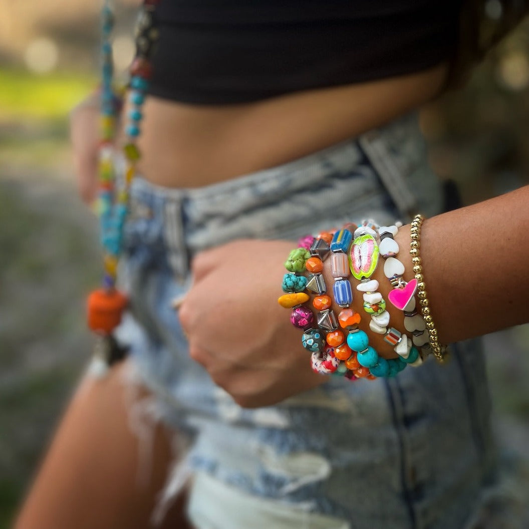 Another model showcasing the Cycle of Life Butterfly Bracelet. The bracelet beautifully complements the model's outfit, adding a touch of nature-inspired elegance.