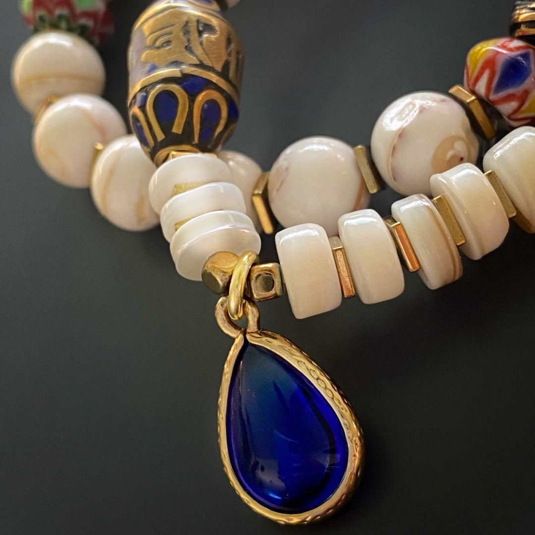 Colorful Ethnic Bracelets - A collection of vibrant bracelets showcasing the rich colors of African beads and gold-plated accents.