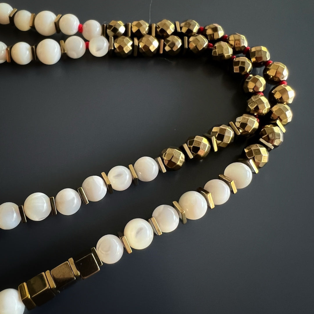 Faravahar Necklace for Spiritual Guidance - Handcrafted jewelry with a symbolic Faravahar pendant, gold hematite and pearl stone beads, fostering inner wisdom