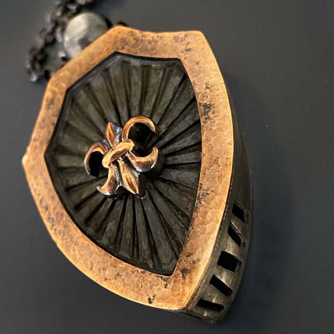 Elegant Fleur de Lis Necklace - Handcrafted accessory with a sterling silver chain and meticulously detailed bronze pendant, capturing the essence of purity and spirituality.