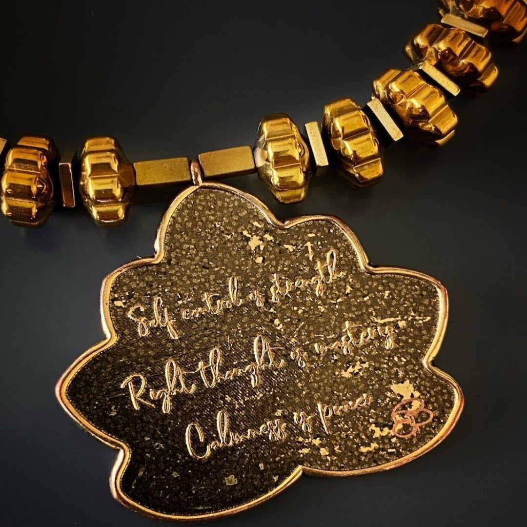 Spiritual Flower Of Life Bracelet - Handmade jewelry piece featuring Om Mani Padme Hum mantra bead, Lotus Flower charm, and gold color hematite beads for inner peace and spiritual growth