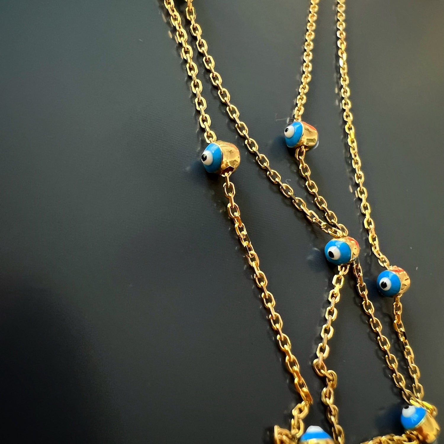 Gold and Diamond Evil Eye Necklace - A luxurious 14k gold necklace with a stunning Evil Eye pendant, embellished with diamonds and vibrant blue and yellow enamel, exuding elegance and charm.