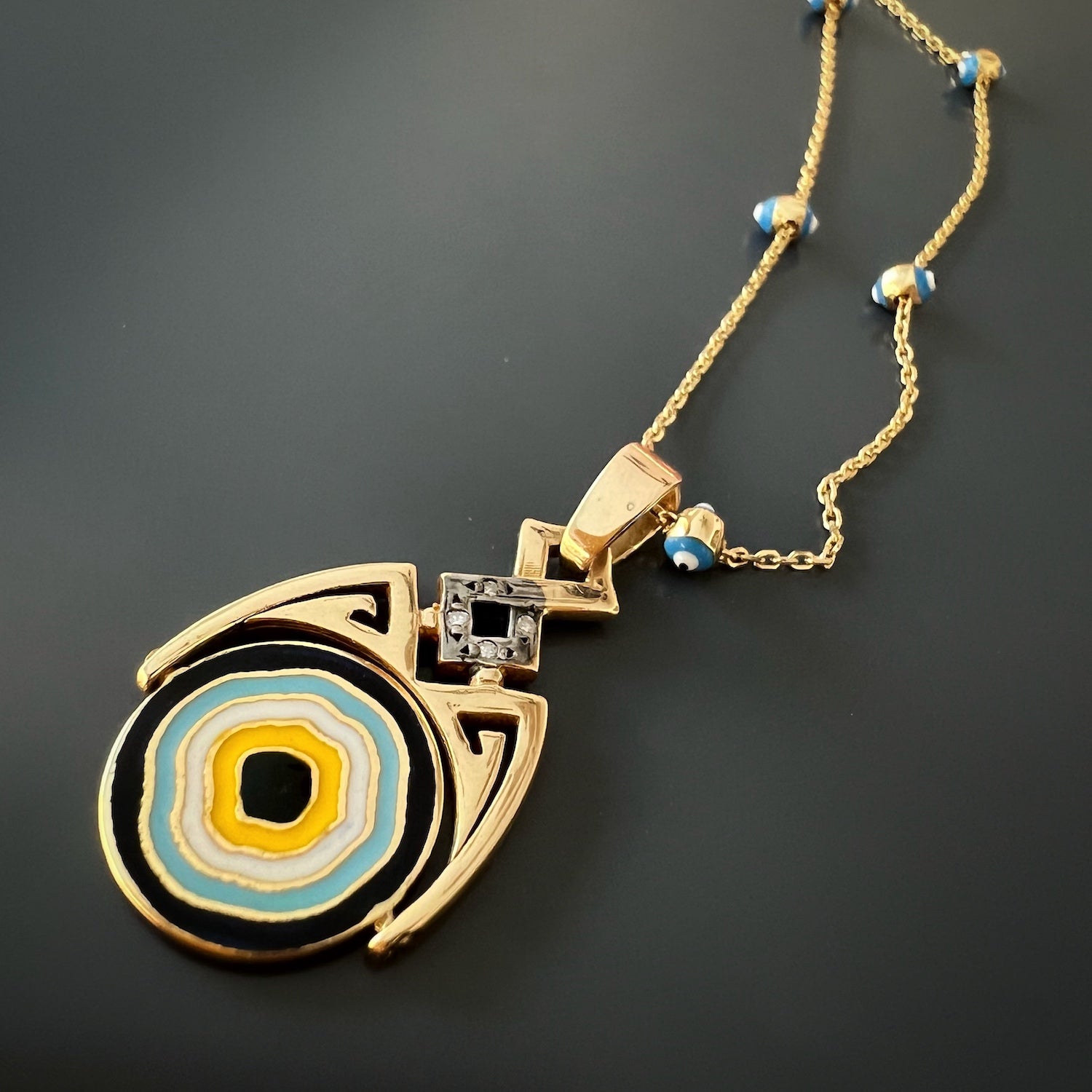 14k Gold Evil Eye Necklace with Diamonds - Embrace protection and style with this handmade necklace crafted from 14k yellow gold. The Evil Eye pendant, embellished with sparkling diamonds and vibrant enamel, is a symbol of good luck and positive energy.